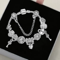 Silver-plated charm bracelet with love heart, lock, and key pendants on black velvet - Silver Bracelet - 9