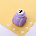 Purple DIY paper puncher with white button creating a cute boy silhouette on paper - Cartoon Series: Boy
