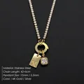 Gold-plated stainless steel necklace featuring a letter X pendant and CZ crystal charm - Letter X (XNL0116)