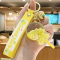 Yellow Good Luck keychain with liquid glitter ball, bell, and lollipop charm pendant - Bead Lollipop - Yellow