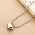 Polished silver stainless steel heart pendant necklace on a sleek snake chain - Steel Color with Chain
