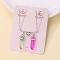 Detail of couple magnetic heart necklaces with green and purple crystal pendants - Green and Pink Stone