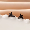 Black stainless steel puppy hollow heart earrings displayed on a white wave porcelain plate - Corgi Face (783) / Black