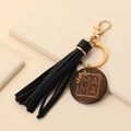 Detalle de llavero con borla de cuero PU negro y colgante redondo de madera con MAMA - Negro