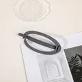 Detailed view of large matte grey oval hair claw clip on a stylish lifestyle background - Oval - Gray