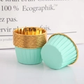 Close-up of mint green cupcake liners with gold foil edges on a clean white surface - Single-sided Mint Green Gold Rim