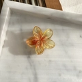 Translucent orange gradient plumeria hair claw clip with golden glitter and resin finish - Yellow Gradient (Small)