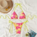 Flat lay of tie-dye bikini set with summer hat and sunglasses on textured background - XS / Yellow and Pink Tie-dye