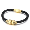 Men's black braided leather bracelet with golden skull accents and magnetic clasp - 19cm / Gold