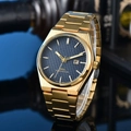 Macro detail of gold watch with blue waffle dial, calendar window and integrated band - 8-Gold Case Deep Blue Dial