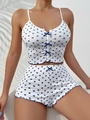 Details zum blau-weißen Pyjama-Set mit Herzprint, süßen Schleifen und gewelltem Saum - S / Blau