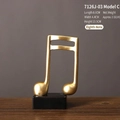 Scultura musicale moderna a forma di croma dorata con base nera per ufficio e casa - Croma Stile C / 8.6x4.4x13.9cm