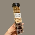 Seamless hair ties set in gradient brown shades held in a clear plastic jar with a label - Latte Brown Series 100Pcs (Bottled)