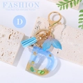 Ocean style resin letter D keychain with blue sea star and gold beach charms - Letter D