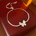 Detail of zircon butterfly bracelet with adjustable sliding buckle on a red gift box - Silver