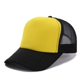 Detail view of contrast mesh trucker hat with yellow front panel and black visor stitch - One Size / Black + Yellow