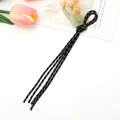 Macro shot of black reflective braided cord for phone case keychain with floral background - Black Style (K3876)