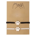 Pair of black and white woven bracelets with metal cat paw charms on a card - Black White Cat Paw(ZJ12322)