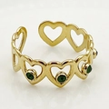 Close-up of golden stainless steel chain ring with hollow hearts and green gemstones - One Size / Green Open Heart Style (R0387-02-green)