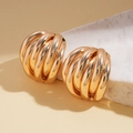 Close-up of golden multi-layered textured metal hoop earrings with elegant brushed finish - Iron/925 Silver Pin / Gold