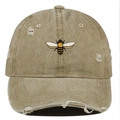 Close-up of bee embroidery detail on khaki washed distressed cotton baseball cap - One Size / Khaki