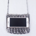 Detailed close-up of a silver chainmail crossbody bag showing size with a smartphone - Silver