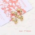 Macro shot of 7x10mm gold moon pendant charms with clear rhinestone for DIY jewelry - Moon / Gold