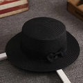 Women's minimalist black straw sun hat with ribbon bow in a vintage flat top style - One Size / Black