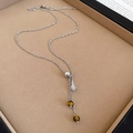 Detail of silver twisted chain necklace featuring tigers eye beads and rhinestone pendant - Silver Rhinestone Teardrop Tiger Eye Necklace