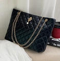 Quilted black tote bag with gold chain strap and elegant pearl crown charm - Black
