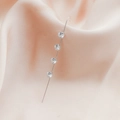 Silver crawler earrings featuring four cubic zirconia stones on pink silk backdrop - Round Zircon Style (DZ-652)