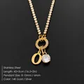 Gold stainless steel tennis necklace featuring letter O pendant and sparkling CZ stone - Letter O (XNL0103)
