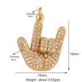Macro detail of Hamsa hand pendant with micro-paved rhinestones and size measurements - M599423-gold / Gold
