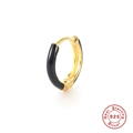 Macro shot of gold-plated S925 sterling silver hoop earring with black enamel inlay - Gold-Black
