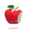 Detail of red enamel apple brooch with green leaves and sparkling rhinestone accents - Christmas Apple