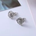 Close-up of hexagonal silver studs with crystal pavé and needle back closure - D12 Silver Hexagon
