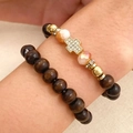 Detail view of woven turtle bracelets with gold cross charm and multi-colored beads - Cross Style / 2-Piece Set / Gold Brown Pink Combination (02)