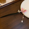 Chinese wood hair pin with pink resin butterflies, tassels and pearls on dark background - Butterfly Rhinestone Teardrop Pearl Tassel Wood Hair Stick