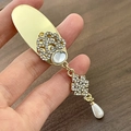 Elegant gold hair clip with white oval gemstone, clover rhinestone and pearl pendant - Gold Base Single Tassel Hair Clip