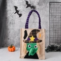 Linen Halloween candy bag with 3D witch appliqué and purple striped handles on gray background - One Size / Witch