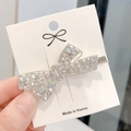 Sparkling silver bow hair clip with crystal rhinestones on a display card - Silver 3D Rhinestone Bowknot