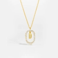 Macro shot of gold S925 sterling silver letter D pendant necklace with pavé set crystals - Letter D