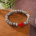 Cross pendant turquoise bead bracelet with speckled white, green, and red stones - White Black Green Red Spotted Red Cross