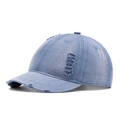 Distressed light blue denim baseball cap with short brim and vintage ripped detailing - Blue