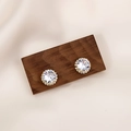Luxurious gold studs with round white zircon and halo setting on a dark wood base - Gold Full Diamond Round