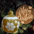 Golden inflatable Christmas ball with white snowflakes hanging on a decorated tree - Small Gold Snowflake