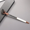 Detail of white metal ballpoint pen with rose gold trim and black crystal stone top - Obsidian