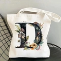 Chic canvas tote bag featuring a floral letter D print on a black wrought iron chair - Letter D / 35*40cm
