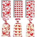 Detail of red and white heart pattern gift bags with golden twist ties for Valentine candy - No.2 Mix 3 Patterns