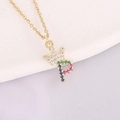 Macro shot of 18K gold crown necklace with colorful zircon letter P pendant detail - Letter P Style